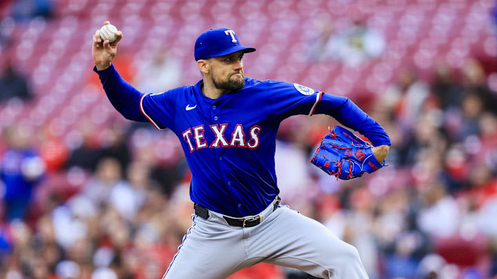 Apr 1, 2025; Cincinnati, Ohio, USA; Texas Rangers starting pitcher Nathan Eovaldi (17) pitches against the Cincinnati Reds in the first inning at Great American Ball Park. 