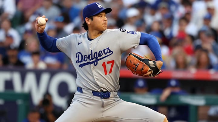Aug 13, 2025; Anaheim, California, USA;  Los Angeles Dodgers two-way player Shohei Ohtani (17) pitches during the second inning against the Los Angeles Angels at Angel Stadium. Mandatory Credit: Kiyoshi Mio-Imagn Images
