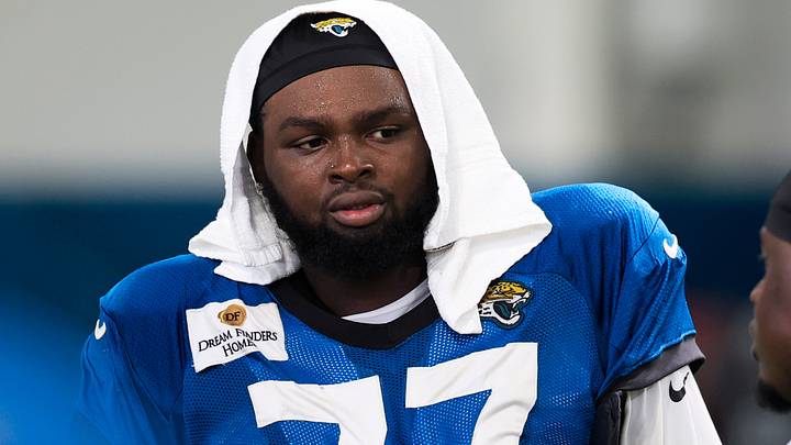 Jacksonville Jaguars offensive tackle Anton Harrison (77) talks with Tampa Bay Buccaneers defensive lineman Calijah Kancey (94) after a joint Buccaneers‑Jaguars NFL practice at the Miller Electric Center on Tuesday, Aug. 25, 2026, in Jacksonville, Fla.