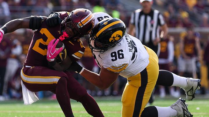 Oct 24, 2026; Minneapolis, Minnesota, USA; Iowa Hawkeyes defensive lineman Bryce Hawthorne (96) tackles Minnesota Golden Gophers running back TJ Thomas (23) during the first half at Huntington Bank Stadium. Mandatory Credit: Matt Krohn-Imagn Images Oct 24, 2026; Minneapolis, Minnesota, USA; Iowa Hawkeyes defensive lineman Bryce Hawthorne (96) tackles Minnesota Golden Gophers running back TJ Thomas (23) during the first half at Huntington Bank Stadium. Mandatory Credit: Matt Krohn-Imagn Images