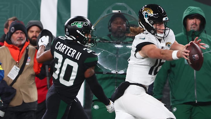 Dec 22, 2022; East Rutherford, New Jersey, USA; Jacksonville Jaguars quarterback Trevor Lawrence (16) runs with the ball against the New York Jets during the first half at MetLife Stadium. Mandatory Credit: Ed Mulholland-Imagn Images Dec 22, 2022; East Rutherford, New Jersey, USA; Jacksonville Jaguars quarterback Trevor Lawrence (16) runs with the ball against the New York Jets during the first half at MetLife Stadium. Mandatory Credit: Ed Mulholland-Imagn Images