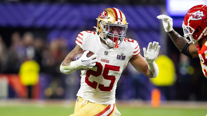 Feb 11, 2024; Paradise, Nevada, USA; San Francisco 49ers running back Elijah Mitchell (25) against Kansas City Chiefs safety Justin Reid (20) in Super Bowl LVIII at Allegiant Stadium. Mandatory Credit: Mark J. Rebilas-Imagn Images