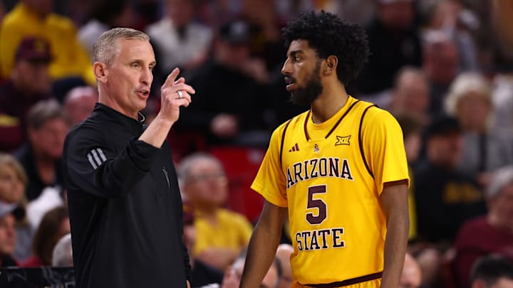 Jan 24, 2026; Tempe, Arizona, USA; Arizona State Sun Devils guard Maurice Odum (5) with head coach Bobby Hurley against the Cincinnati Bearcats in the second half at Desert Financial Arena. Mandatory Credit: Mark J. Rebilas-Imagn Images