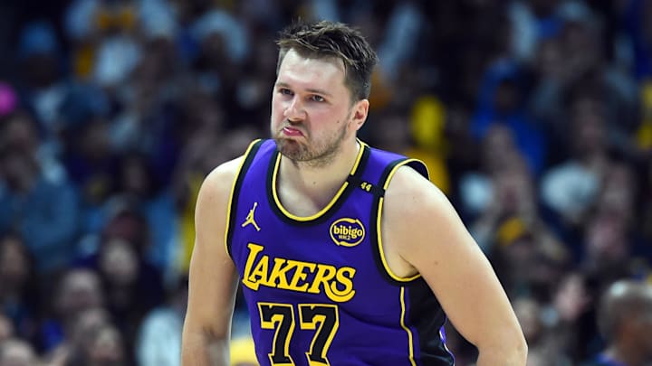 Feb 22, 2025; Denver, Colorado, USA; Los Angeles Lakers guard Luka Doncic (77) celebrates after a basket during the first half against the Denver Nuggets at Ball Arena. Mandatory Credit: Christopher Hanewinckel-Imagn Images