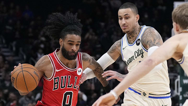 Feb 3, 2026; Milwaukee, Wisconsin, USA; Chicago Bulls guard Coby White (0) drives to the basket against Milwaukee Bucks forward Kyle Kuzma (18) in the first half at Fiserv Forum. Mandatory Credit: Michael McLoone-Imagn Images