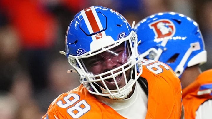 Nov 6, 2025; Denver, Colorado, USA; Denver Broncos defensive end John Franklin-Myers (98) reacts against the Las Vegas Raiders during the first half at Empower Field at Mile High. Mandatory Credit: Ron Chenoy-Imagn Images