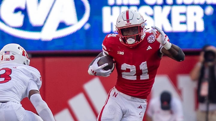 Nebraska running back Emmett Johnson rushes for a short gain against Rutgers.