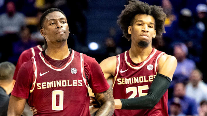 Dec 3, 2024; Baton Rouge, Louisiana, USA; Florida State Seminoles guard Justin Thomas (25) holds back guard Chandler Jackson (0) after a play against the LSU Tigers during the second half at Pete Maravich Assembly Center. Mandatory Credit: Stephen Lew-Imagn Images