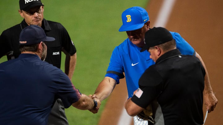 Auburn Tigers head coach Butch Thompson  and UCLA Bruins head coach John Savage shake hands before the Auburn Tigers take on UCLA Bruins during the NCAA regional baseball tournament at Plainsman Park in Auburn, Ala., on Sunday, June 5, 2022.