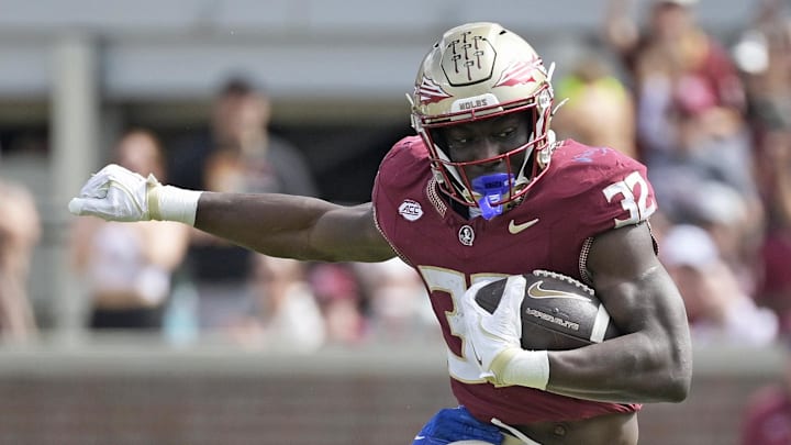 Oct 11, 2025; Tallahassee, Florida, USA; Florida State Seminoles running back Ousmane Kromah (32) is tackled by Pittsburgh Panthers linebacker Braylan Lovelace (0) during the second half at Doak S. Campbell Stadium. Mandatory Credit: Melina Myers-Imagn Images Oct 11, 2025; Tallahassee, Florida, USA; Florida State Seminoles running back Ousmane Kromah (32) is tackled by Pittsburgh Panthers linebacker Braylan Lovelace (0) during the second half at Doak S. Campbell Stadium. Mandatory Credit: Melina Myers-Imagn Images