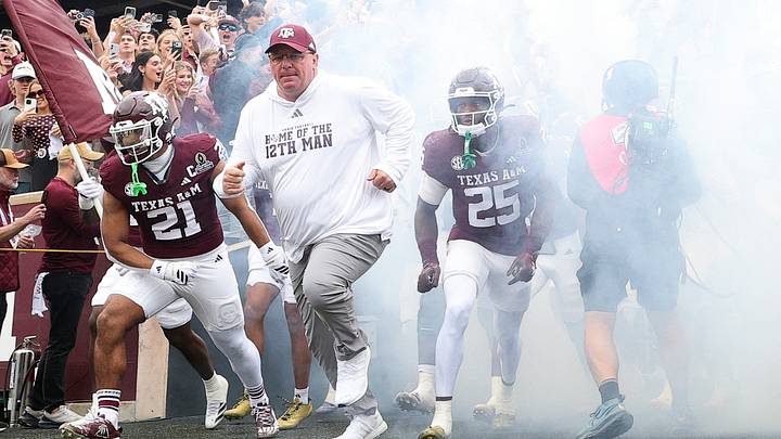 Texas A&M Aggies head coach Mike Elko takes the field prior to the game against the Miami Hurricanes during the first round of the CFP National Playoff at Kyle Field. Texas A&M Aggies head coach Mike Elko takes the field prior to the game against the Miami Hurricanes during the first round of the CFP National Playoff at Kyle Field.