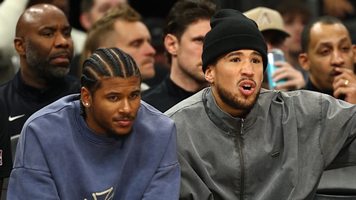 Jan 29, 2026; Phoenix, Arizona, USA; Phoenix Suns injured guard Jalen Green (left) and Devin Booker on the bench against the Detroit Pistons in the first half at Mortgage Matchup Center. Mandatory Credit: Mark J. Rebilas-Imagn Images
