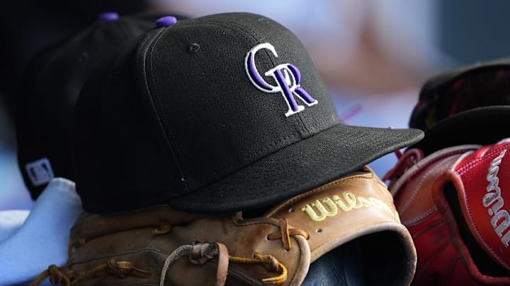 General view of a players cap and glove of the Colorado Rockies 