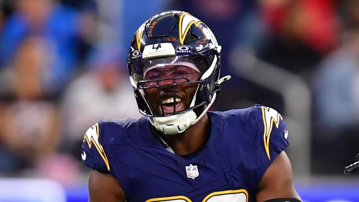 Dec 27, 2025; Inglewood, California, USA; Los Angeles Chargers linebacker Odafe Oweh (98) and linebacker Daiyan Henley (0) react after a defensive play against the Houston Texans during the second half at SoFi Stadium. Mandatory Credit: Gary A. Vasquez-Imagn Images Dec 27, 2025; Inglewood, California, USA; Los Angeles Chargers linebacker Odafe Oweh (98) and linebacker Daiyan Henley (0) react after a defensive play against the Houston Texans during the second half at SoFi Stadium. Mandatory Credit: Gary A. Vasquez-Imagn Images