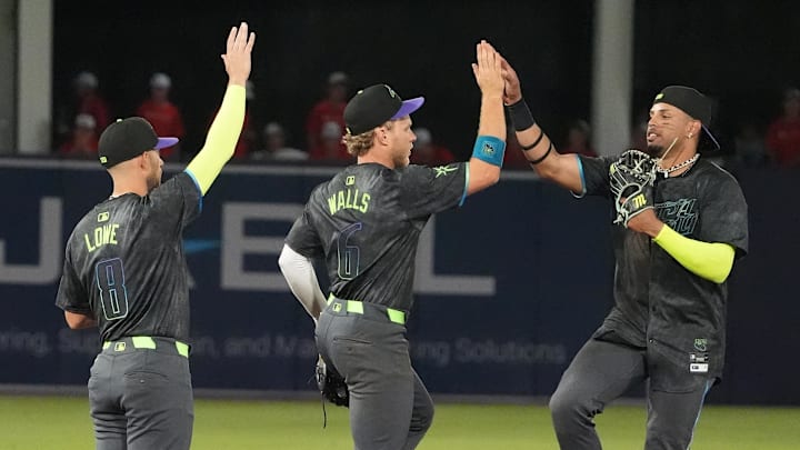 Tampa Bay Rays outfielder Christopher Morel (right) is congratulated by Taylor Walls (center) and Brandon Lowe after a win. Tampa Bay Rays outfielder Christopher Morel (right) is congratulated by Taylor Walls (center) and Brandon Lowe after a win.