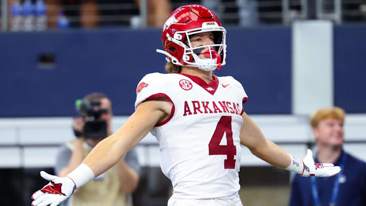 Arkansas Razorbacks wide receiver Isaac TeSlaa (4) celebrates after scoring a touchdown during the first quarter against the Texas A&M Aggies at AT&T Stadium.