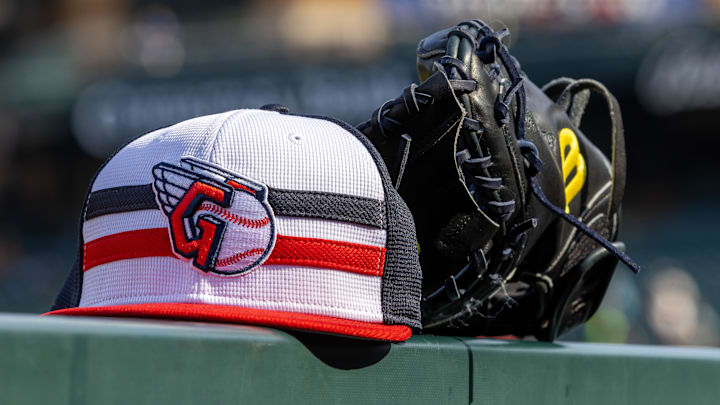 Jul 8, 2024; Detroit, Michigan, USA; A Cleveland Guardians baseball cap and glove sit on the dugout rail before the game against the Detroit Tigers at Comerica Park. Mandatory Credit: David Reginek-Imagn Images Jul 8, 2024; Detroit, Michigan, USA; A Cleveland Guardians baseball cap and glove sit on the dugout rail before the game against the Detroit Tigers at Comerica Park. Mandatory Credit: David Reginek-Imagn Images