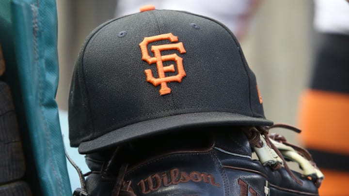 Jul 14, 2023; Pittsburgh, Pennsylvania, USA;  San Francisco Giants hat and glove on the bench against the Pittsburgh Pirates during the first inning at PNC Park. 