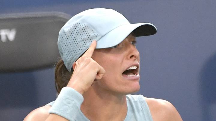 Iga Swiatek reacts after defeating Elena Rybakina