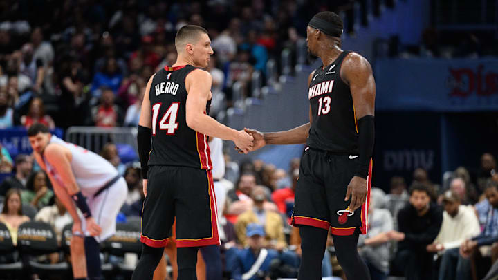 Mar 31, 2025; Washington, District of Columbia, USA; Miami Heat guard Tyler Herro (14) and center Bam Adebayo (13) react during the third quarter against the Washington Wizards at Capital One Arena. Mandatory Credit: Reggie Hildred-Imagn Images Mar 31, 2025; Washington, District of Columbia, USA; Miami Heat guard Tyler Herro (14) and center Bam Adebayo (13) react during the third quarter against the Washington Wizards at Capital One Arena. Mandatory Credit: Reggie Hildred-Imagn Images