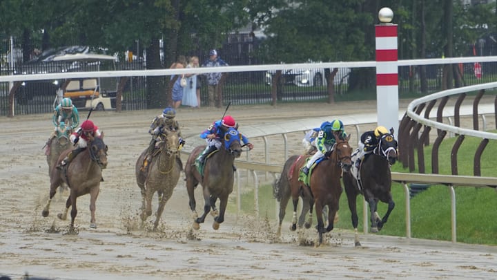 Jun 7, 2025; Saratoga, NY, USA; Certified Loverboy (12) with Flavien Prat up and Swiftsure (2) with Luis Saez up battle for the lead through turn four of Race 3 at Saratoga Race Course. 