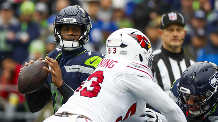 Nov 24, 2024; Seattle, Washington, USA; Seattle Seahawks quarterback Geno Smith (7) looks to pass against the Arizona Cardinals during the first quarter at Lumen Field.