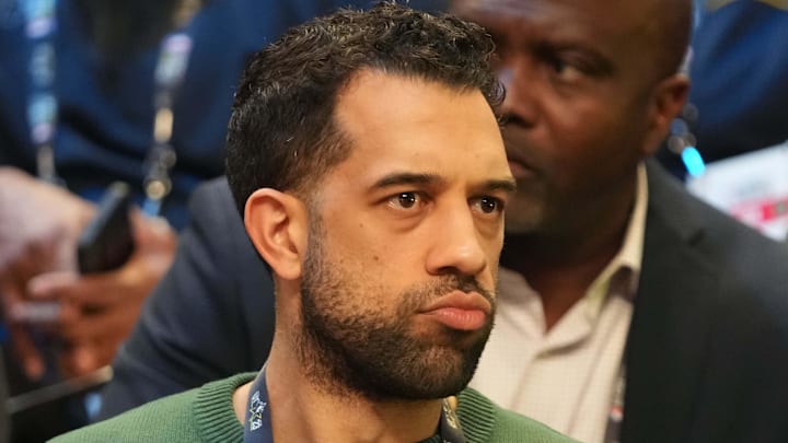 Atlanta Hawks general manager Landry Fields looks on.