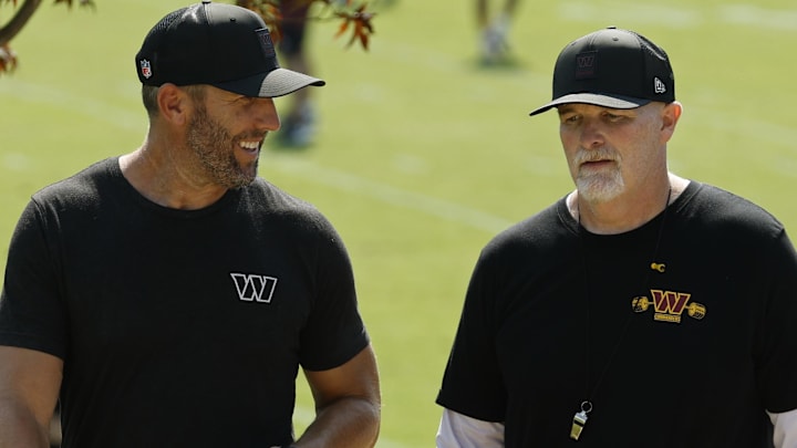Washington Commanders general manager Adam Peters (L) talks with Commanders head coach Dan Quinn (R) Mandatory Credit: Geoff Burke-Imagn Images