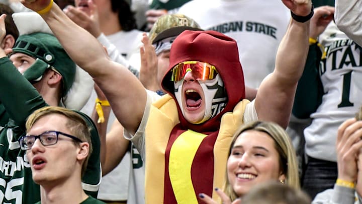 A member of the Izzone dressed up as a hot dog cheer during Michigan State's game against Illinois on Saturday, Feb. 7, 2026, at the Breslin Center in East Lansing.