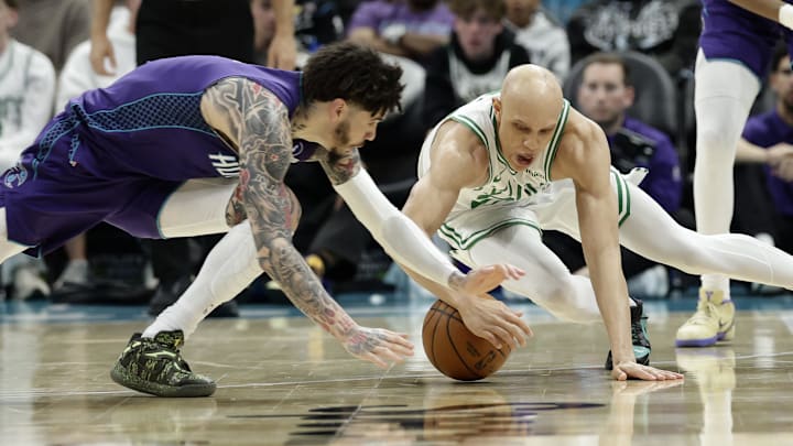 Mar 29, 2026; Charlotte, North Carolina, USA; Boston Celtics guard Jordan Walsh (27) fights for a loose ball with Charlotte Hornets guard LaMelo Ball (1) during the second quarter at Spectrum Center. Mandatory Credit: Brian Westerholt-Imagn Images Mar 29, 2026; Charlotte, North Carolina, USA; Boston Celtics guard Jordan Walsh (27) fights for a loose ball with Charlotte Hornets guard LaMelo Ball (1) during the second quarter at Spectrum Center. Mandatory Credit: Brian Westerholt-Imagn Images