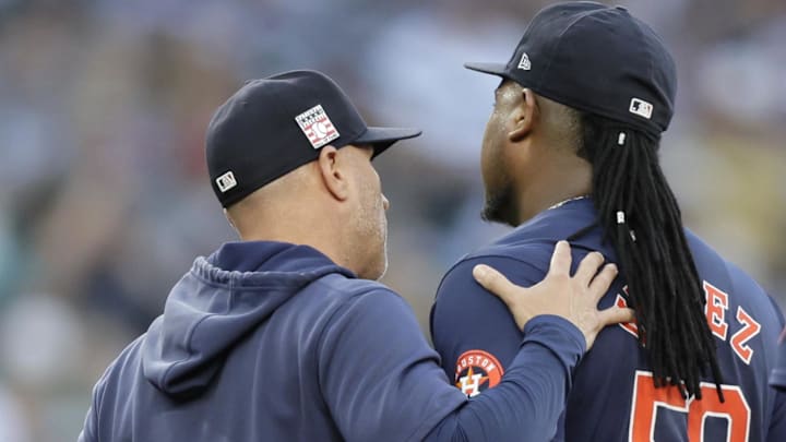 Jul 20, 2024; Seattle, Washington, USA; Houston Astros manager Joe Espada (19) pats starting pitcher Framber Valdez (59) on the back as Valdez is pulled from the game against the Seattle Mariners during the sixth inning at T-Mobile Park Jul 20, 2024; Seattle, Washington, USA; Houston Astros manager Joe Espada (19) pats starting pitcher Framber Valdez (59) on the back as Valdez is pulled from the game against the Seattle Mariners during the sixth inning at T-Mobile Park