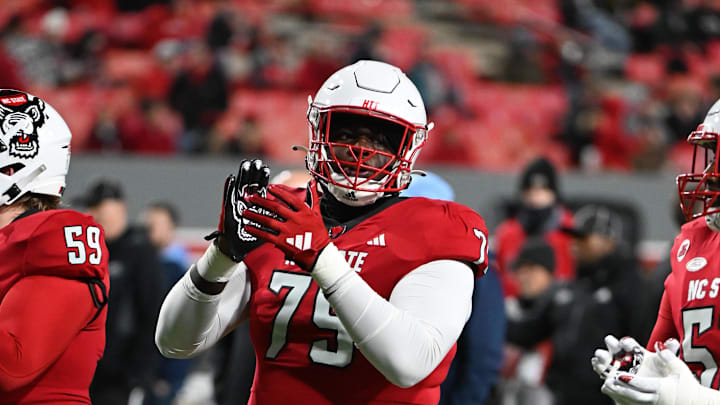 Nov 25, 2023; Raleigh, North Carolina, USA;  North Carolina State Wolfpack offensive lineman Anthony Carter Jr. (75) warms up prior to a game against the North Carolina Tar Heels at Carter-Finley Stadium. Mandatory Credit: Rob Kinnan-Imagn Images