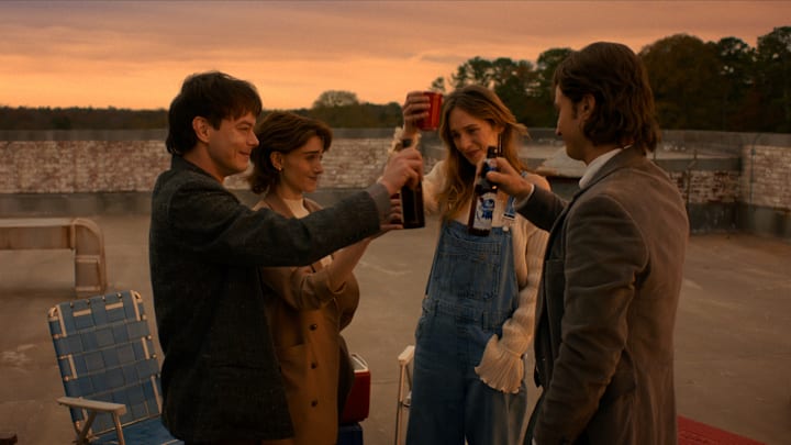Jonathan Byers, Nancy Wheeler, Robin Buckley, and Steve Harrington on a rooftop in the Stranger Things finale.