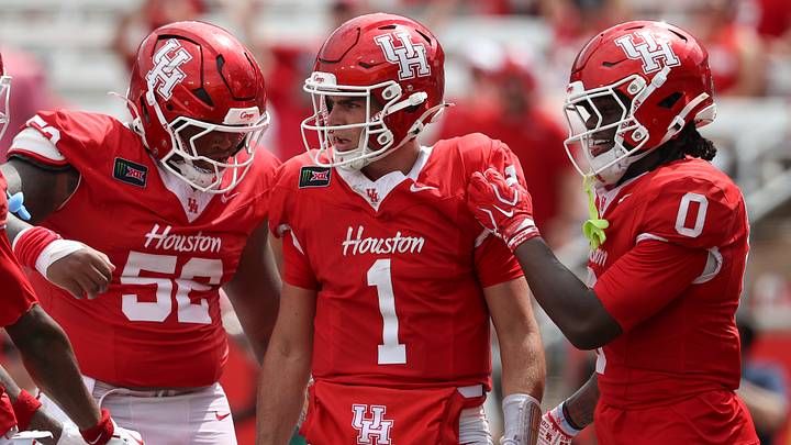 Sep 5, 2026; Houston, Texas, USA; Houston Cougars quarterback Conner Weigman (1) reacts with offensive lineman Anthony Boswell (52) and wide receiver Amare Thomas (0) after a play during the fourth quarter against the Oregon State Beavers at TDECU Stadium. Mandatory Credit: Troy Taormina-Imagn Images Sep 5, 2026; Houston, Texas, USA; Houston Cougars quarterback Conner Weigman (1) reacts with offensive lineman Anthony Boswell (52) and wide receiver Amare Thomas (0) after a play during the fourth quarter against the Oregon State Beavers at TDECU Stadium. Mandatory Credit: Troy Taormina-Imagn Images
