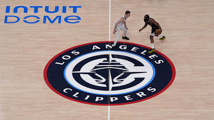 May 1, 2025; Inglewood, California, USA; A general overall view as LA Clippers guard James Harden (1) dribbles the ball against Denver Nuggets guard Christian Braun (0) at micourt on the Clippers logo in the first half during game six of first round for the 2025 NBA Playoffs at Intuit Dome. Mandatory Credit: Kirby Lee-Imagn Images