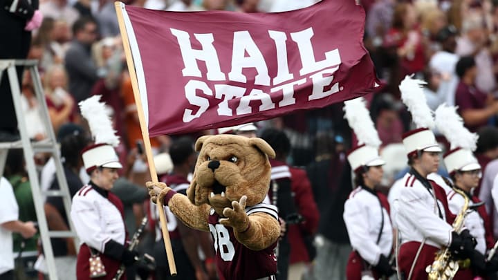 Mississippi State Bulldogs mascot Bully waves a “Hail State” flag prior to the game against the Texas Longhorns at Davis Wade Stadium at Scott Field.