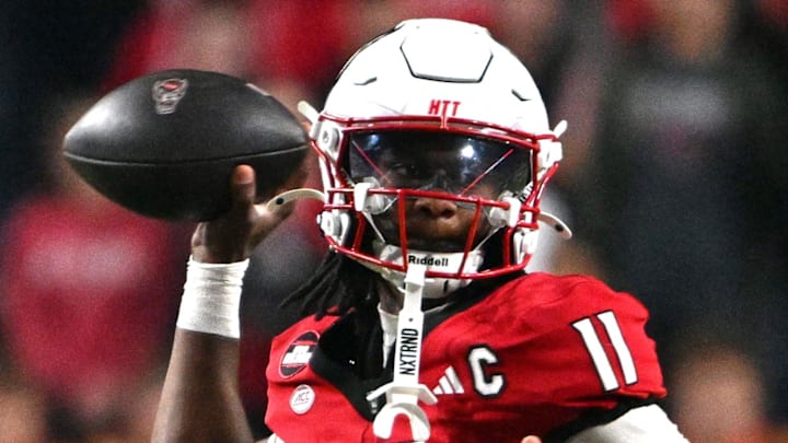 Nov 1, 2025; Raleigh, North Carolina, USA;  North Carolina State Wolfpack quarterback CJ Bailey (11) throws a pass during the first quarter against the Georgia Tech Yellow Jackets at Carter-Finley Stadium. Mandatory Credit: Zachary Taft-Imagn Images