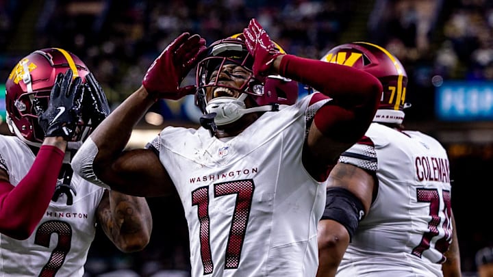 Dec 15, 2024; New Orleans, Louisiana, USA;  Washington Commanders wide receiver Terry McLaurin (17) reacts to scoring a touchdown against the New Orleans Saints during the first half at Caesars Superdome. Mandatory Credit: Stephen Lew-Imagn Images
