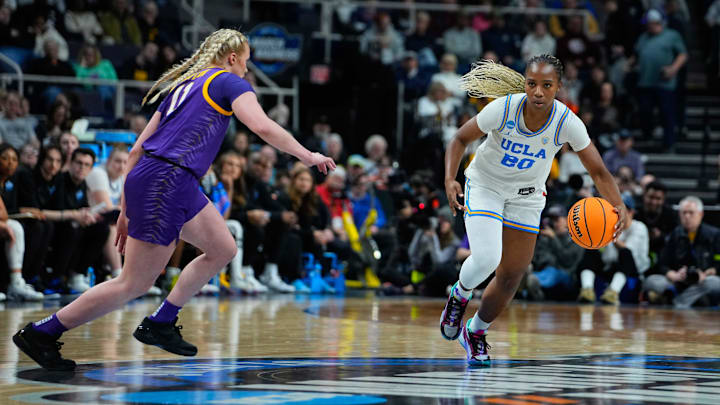 Mar 30, 2024; Albany, NY, USA; UCLA Bruins guard Charisma Osborne (20) dribbles the ball.