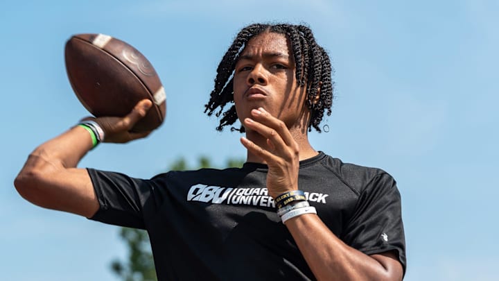 Donald Tabron II, 16, a quarterback at Cass Technical High School, throws a football during a private workout in Detroit on Saturday, June 21, 2025.