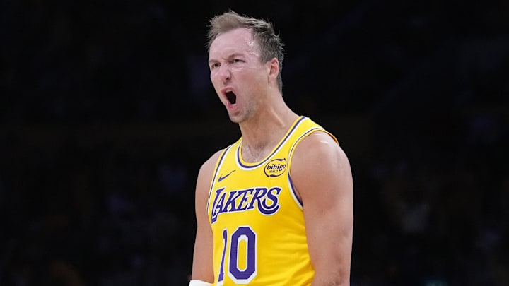 Apr 18, 2026; Los Angeles, California, USA; Los Angeles Lakers guard Luke Kennard (10) and center Deandre Ayton (5) celebrate against the Houston Rockets in the second half during game one of the first round of the 2026 NBA Playoffs at Crypto.com Arena. Mandatory Credit: Kirby Lee-Imagn Images