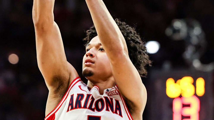 Feb 14, 2026; Tucson, Arizona, USA; Arizona Wildcats guard Brayden Burries (5) shoots a three pointer during the second half of the game against the Texas Tech Red Raiders at McKale Memorial Center. Mandatory Credit: Aryanna Frank-Imagn Images