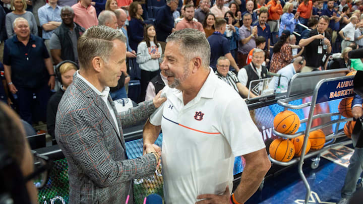 Alabama Crimson Tide head coach Nate Oats and Auburn Tigers head coach Bruce Pearl shake hands before the game as Auburn Tigers take on Alabama Crimson Tide at Neville Arena in Auburn, Ala., on Saturday, March 8, 2025.