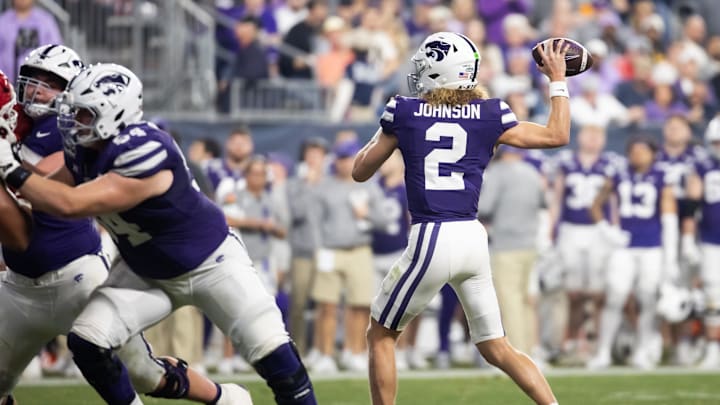 Dec 26, 2024; Phoenix, AZ, USA; Kansas State Wildcats quarterback Avery Johnson (2) against the Rutgers Scarlet Knights during the Rate Bowl at Chase Field. Mandatory Credit: Mark J. Rebilas-Imagn Images