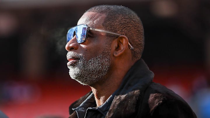 Dec 21, 2025; Cleveland, Ohio, USA;  Legendary  football and baseball player and father of Cleveland Browns quarterback Shedeur Sanders, Deion Sanders on the sidelines prior to a game against the Buffalo Bills at Huntington Bank Field. Credit: Scott Galvin-Imagn Images