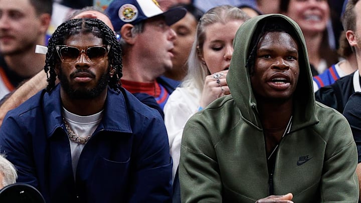 Oct 24, 2023; Denver, Colorado, USA; University of Colorado Buffaloes football players Shedeur Sanders (L) and Travis Hunter (R) watch during the third period between the Denver Nuggets and the Los Angeles Lakers at Ball Arena. Mandatory Credit: Isaiah J. Downing-Imagn Images