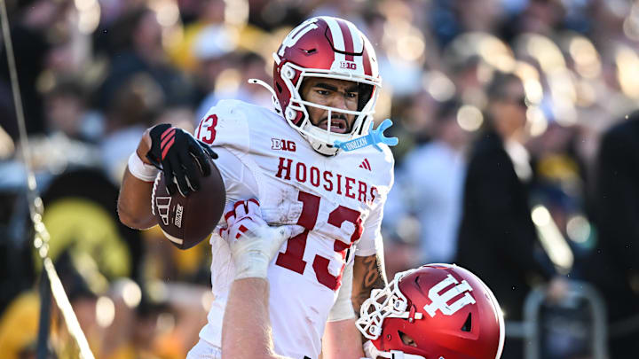 Indiana Hoosiers wide receiver Elijah Sarratt (13) celebrates a late touchdown against the Iowa Hawkeyes at Kinnick Stadium. Indiana Hoosiers wide receiver Elijah Sarratt (13) celebrates a late touchdown against the Iowa Hawkeyes at Kinnick Stadium.