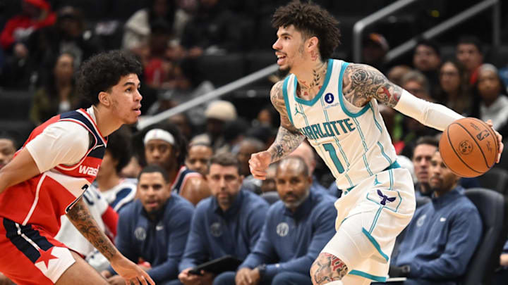 Washington Wizards guard Will Riley (27) and Charlotte Hornets guard LaMelo Ball (1) Washington Wizards guard Will Riley (27) and Charlotte Hornets guard LaMelo Ball (1)
