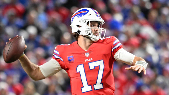 Allen throws a pass in a red jersey versus the New York Giants. Allen throws a pass in a red jersey versus the New York Giants.