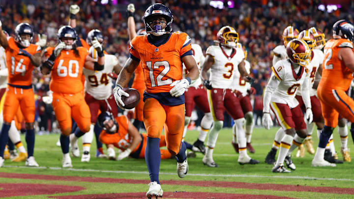 Nov 30, 2025; Landover, Maryland, USA; Denver Broncos running back RJ Harvey (12) celebrates after scoring a touchdown against the Washington Commanders in overtime of the game at Northwest Stadium. Mandatory Credit: Peter Casey-Imagn Images